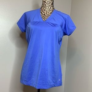 Women’s Blue Danskin Shortsleeved Top Large Small pinpoint black spot on front